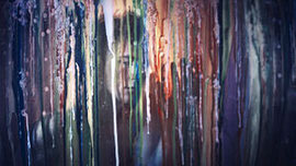 An abstract painting of colorful vertical drips and streaks, artwork accompanying a 10 Questions Answered interview with photographer Rob Woodcox