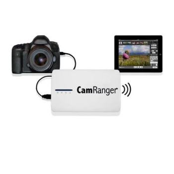 The CamRanger wireless transmitter connected to a DSLR, with a tablet beside it showing the live view