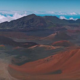 Wide panoramic view of a mountain summit above the clouds, demonstrating how to make a panorama in Photoshop