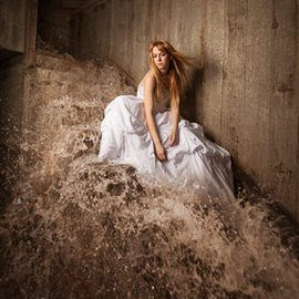Woman in a white dress sitting on flooded concrete ruins with rushing water, Photoshop compositing tutorial thumbnail