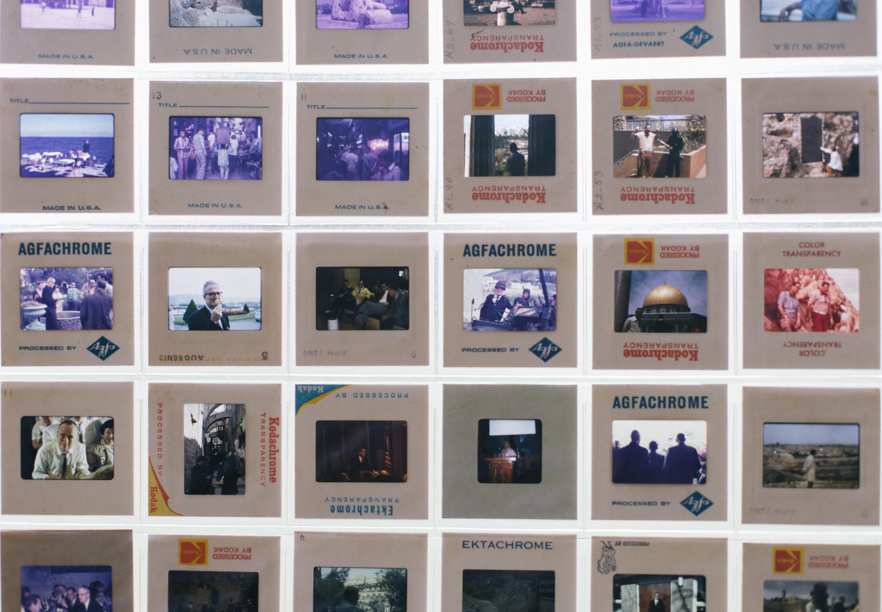 Grid of old mounted color slides marked Kodachrome, Agfachrome and Ektachrome, showing crowds, portraits and a golden dome