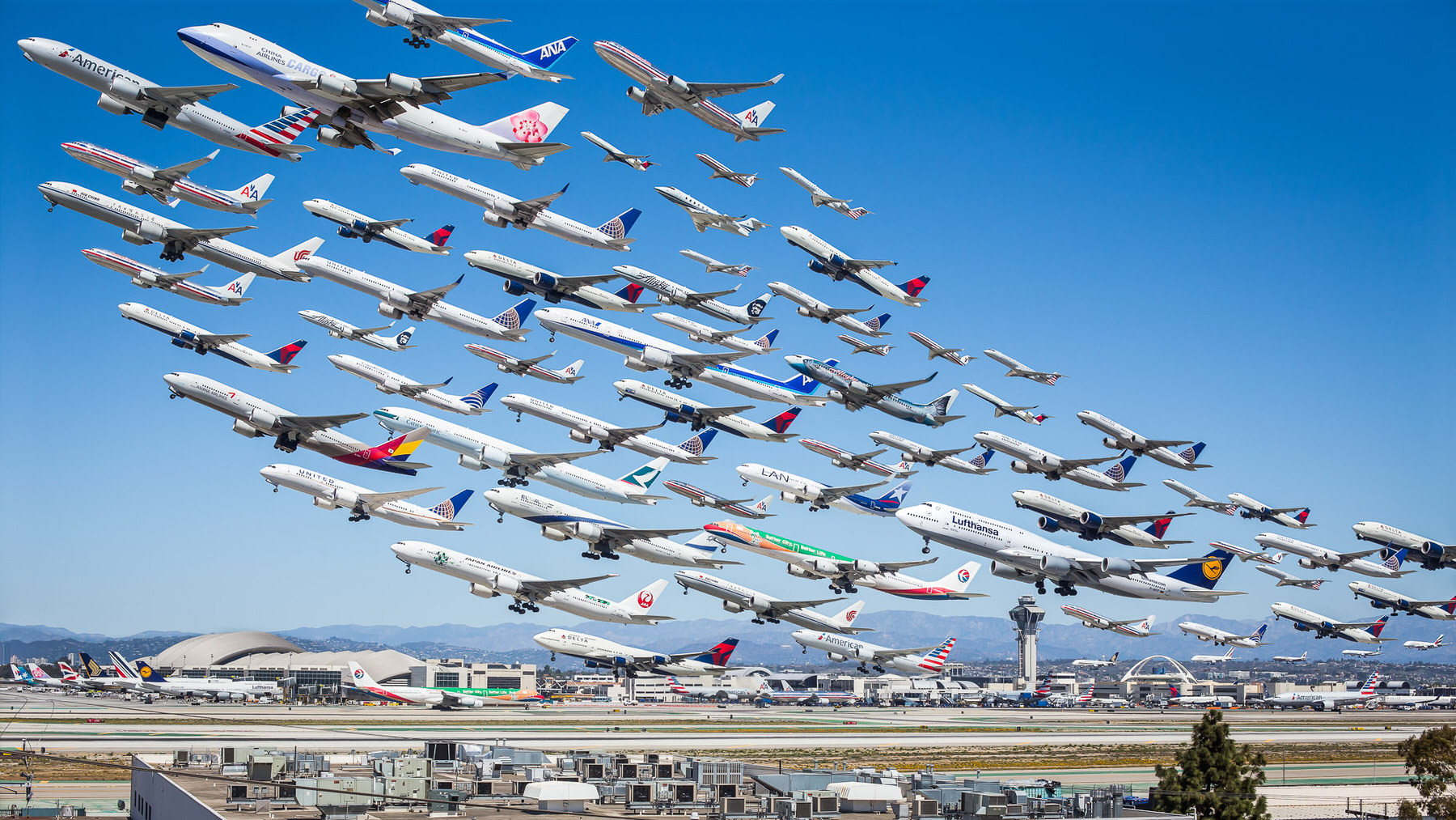 Mike Kelley’s Wake Turbulence: composite of dozens of airliners taking off in one blue sky above an airport and its control tower