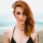 Portrait of a woman with windblown red hair, edited with the Smart Dodge & Burn action