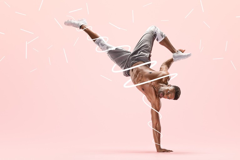 Athlete balancing on one hand on a pink background with white light trails