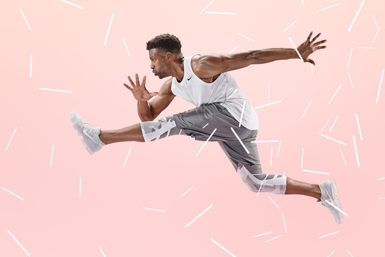 Athlete leaping across a pink background with white graphic shapes, final athlete composite