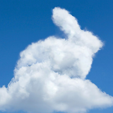 Large white cumulus cloud against a blue sky, example for creating custom cloud shapes in Photoshop