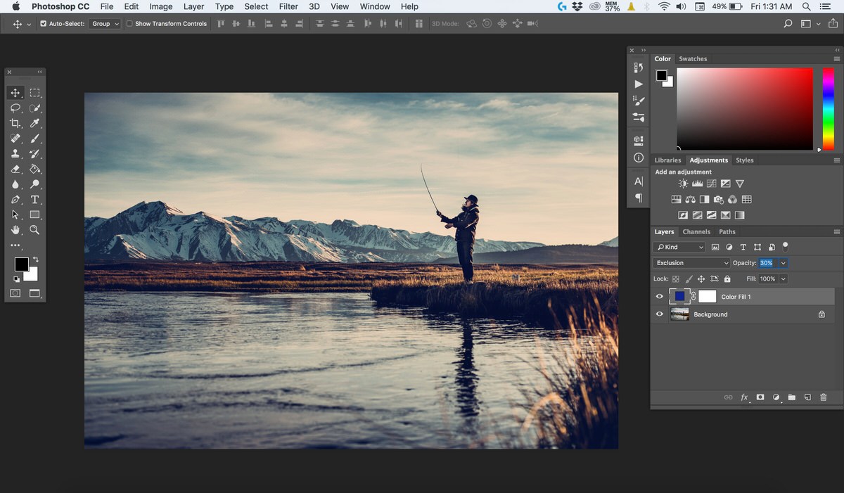 The fly fishing photo after the blue Exclusion layer is applied at reduced opacity, showing cool shadows and warm highlights