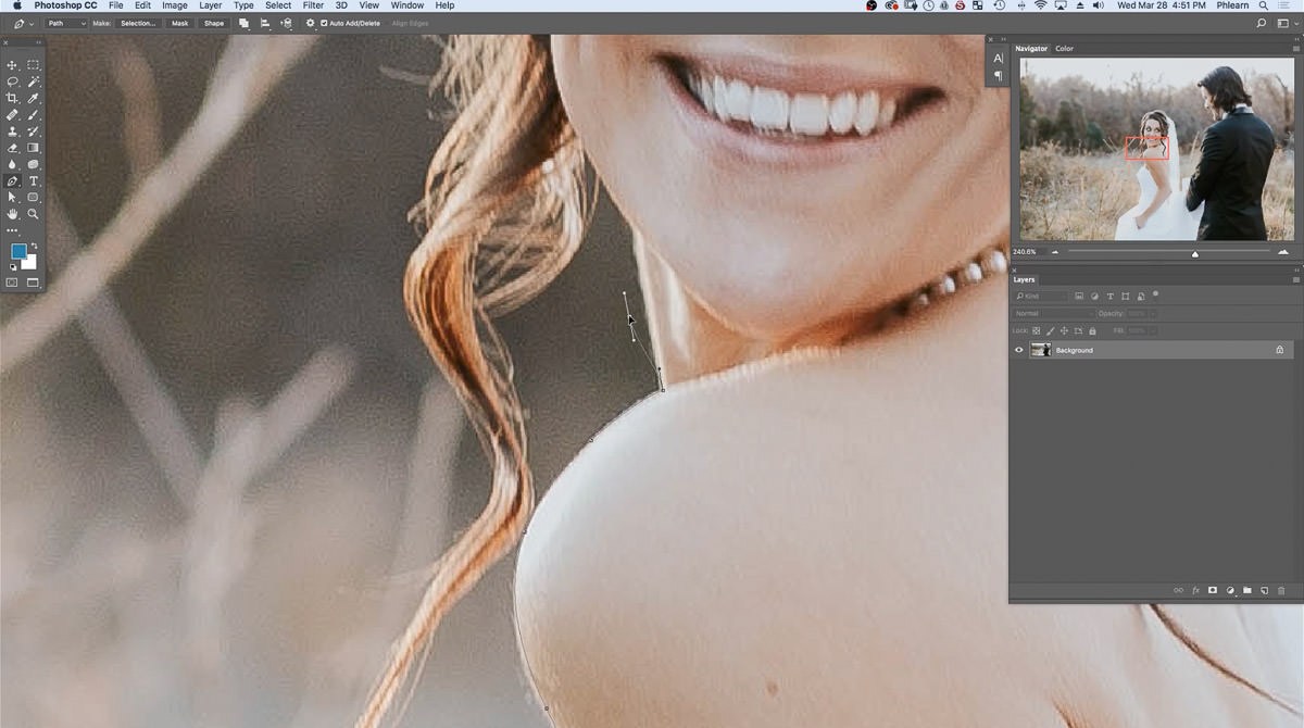 Holding Alt or Option to drag a Pen tool direction handle straight up, changing the path's direction at the bride's shoulder