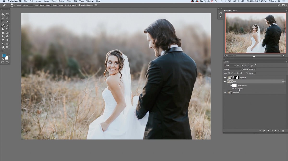 The Tilt-Shift blur applied as an editable Blur Gallery smart filter on the Blur layer, with the couple sharp in front