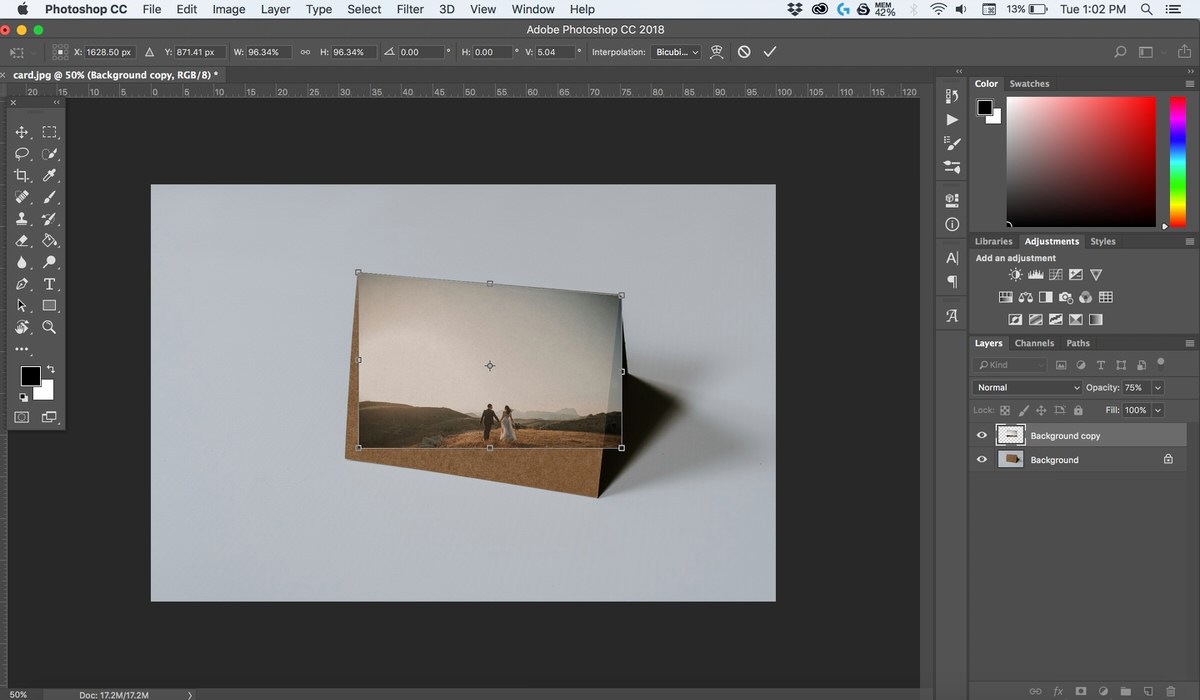 Photoshop screenshot showing the finished composite of the couple's photo resized onto the card mockup