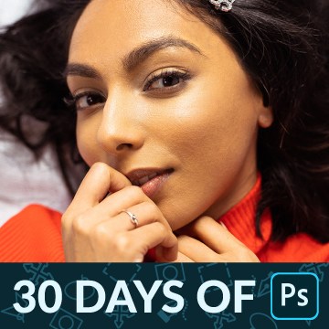 Portrait of a woman with dark curly hair in an orange sweater resting her hand near her chin, skin retouched using frequency separation, 30 Days of Photoshop Day 24