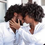 Couple with foreheads touching indoors, graded with the Moody Vibe LUTs