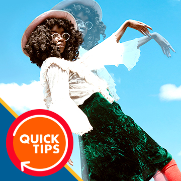 Woman in a floral top and green skirt with her arm repositioned into a dance pose, demonstrating how to move body parts in Photoshop