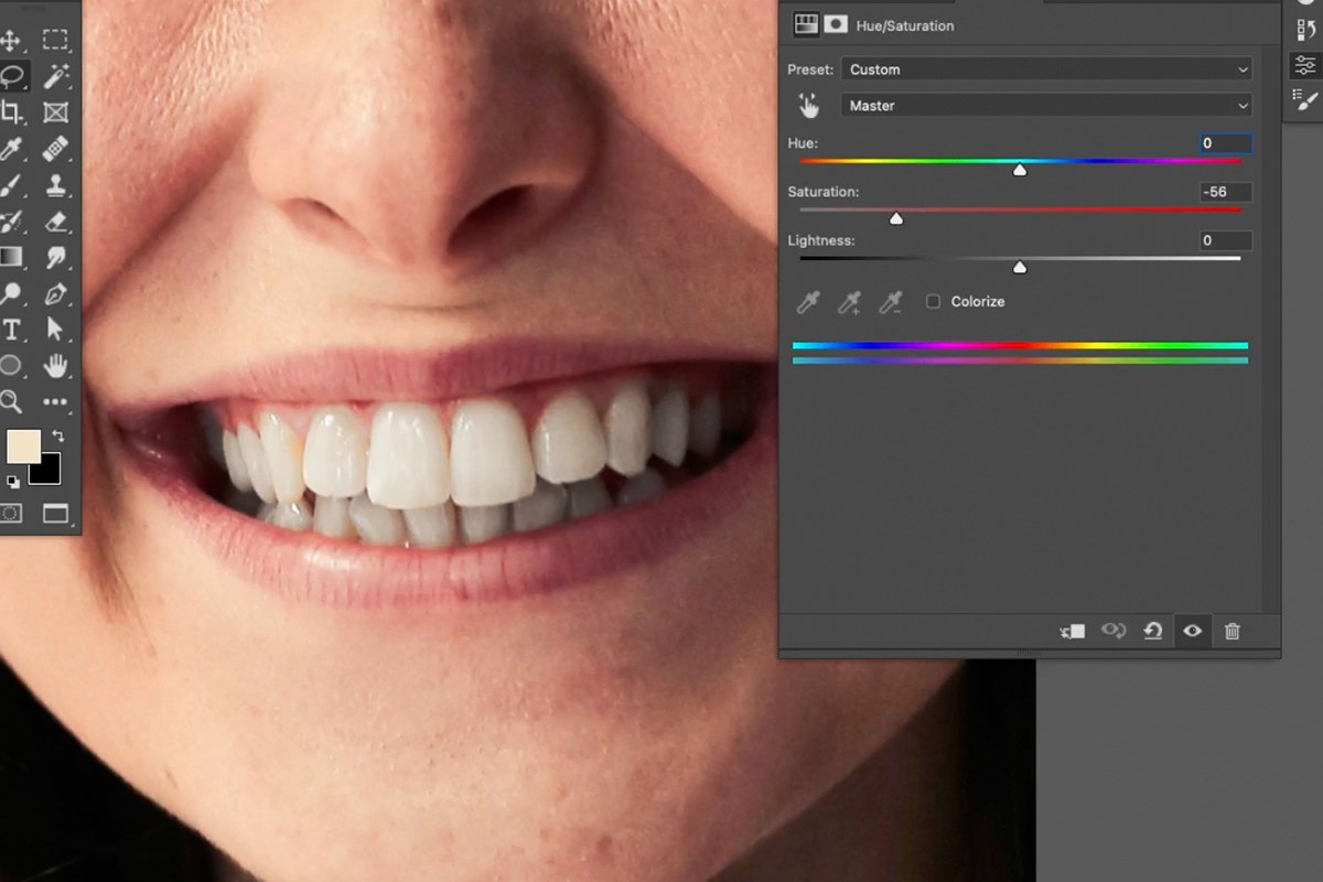 adding a Curves adjustment layer to brighten the teeth
