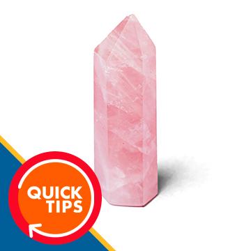 A pink crystal point standing with its shadow preserved on a plain white background, demonstrating how to remove a background and keep the shadows in Photoshop