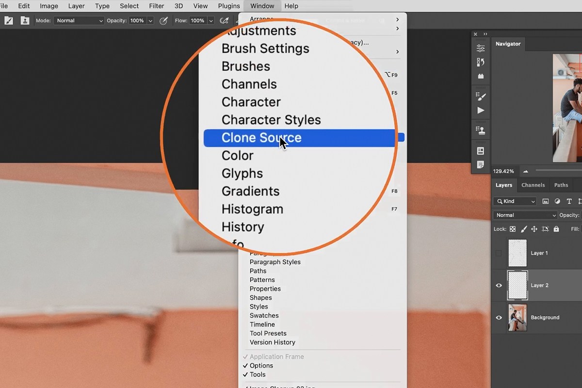 Clone Stamp tool sampling a clean point along an edge and painting over the distraction