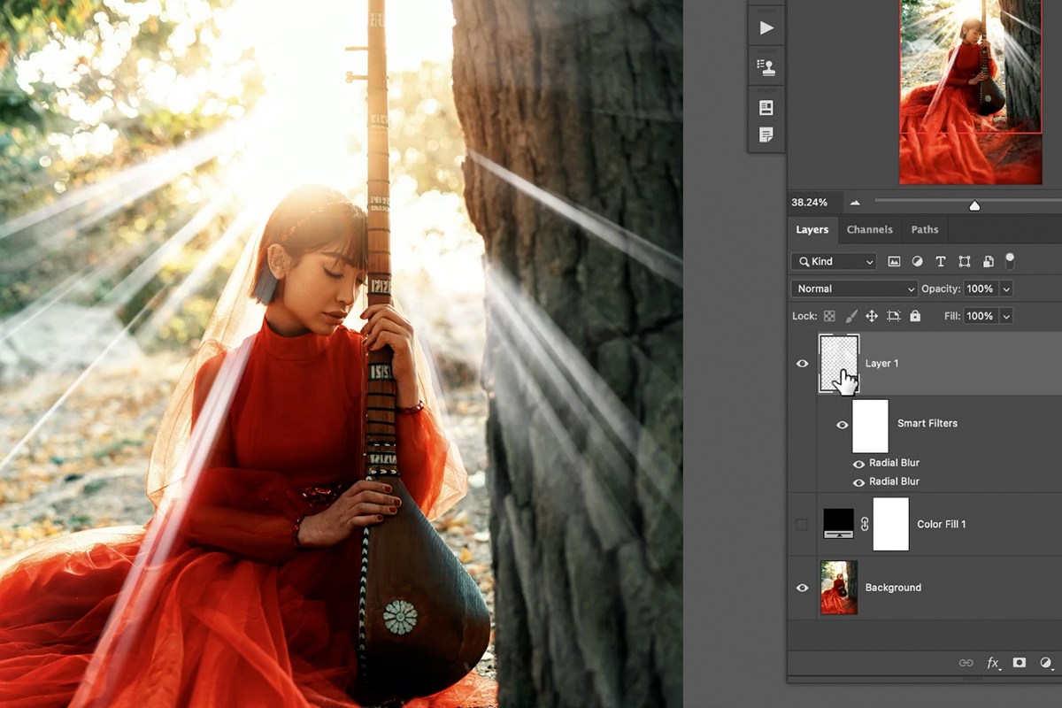Two Radial Blur Smart Filters stacked on the same rays layer in the Layers panel, producing softer, more refined light rays