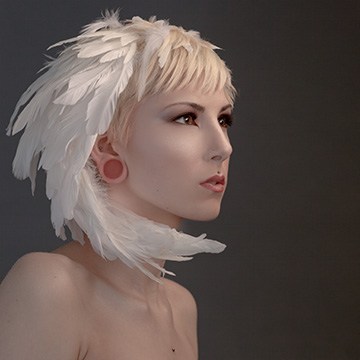 Portrait of a woman with a white feathered headpiece and smooth retouched skin, demonstrating how to use frequency separation in Photoshop