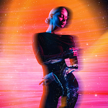 Woman composited with glowing cosmic light streaks and stars, thumbnail for a tutorial on surreal portrait compositing with light, color and effects