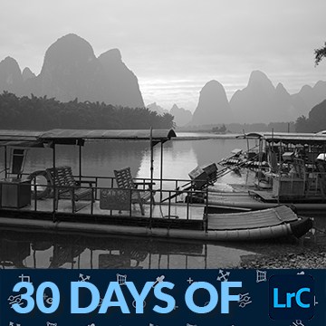 Black-and-white landscape of karst mountains along a river, thumbnail for a tutorial on converting to black and white in Lightroom Classic
