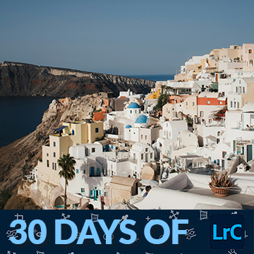 Whitewashed cliffside village with blue-domed buildings overlooking the sea, thumbnail for a tutorial on batch renaming photos in Lightroom Classic