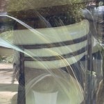 A chair seen through a reflective window