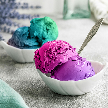 Bowls of teal, purple, and pink ice cream scoops, thumbnail for a tutorial on changing any color into a gradient in Photoshop