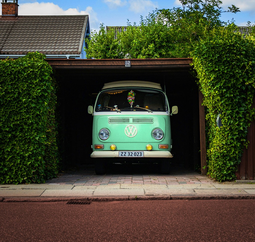 The same bus recolored to sea-foam green with hue saturation adjustment layers in Photoshop