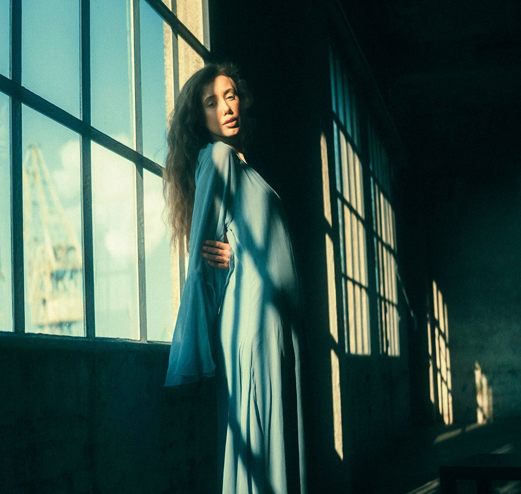 The same portrait after color grading in Camera Raw, with cool shadows and warm highlights