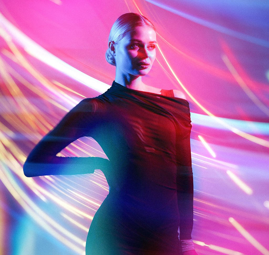 The finished composite, with light streaks passing in front of and behind the subject