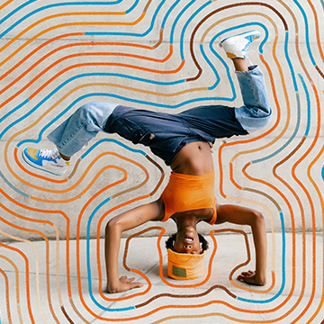 A person mid-breakdance headstand composited with colorful swirling line graphics — The Beginner's Guide to Graphic Photography tutorial thumbnail