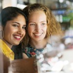 Two women smiling together