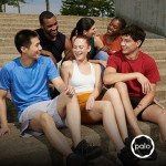 Five friends laughing on outdoor steps