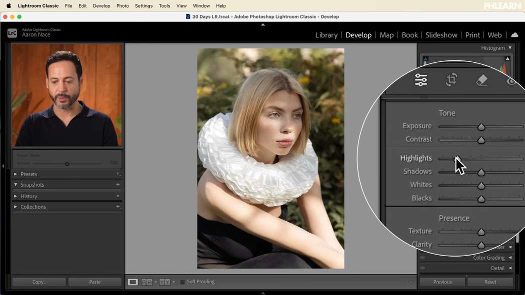 Dragging the Highlights slider in the Lightroom Basic panel while watching the histogram