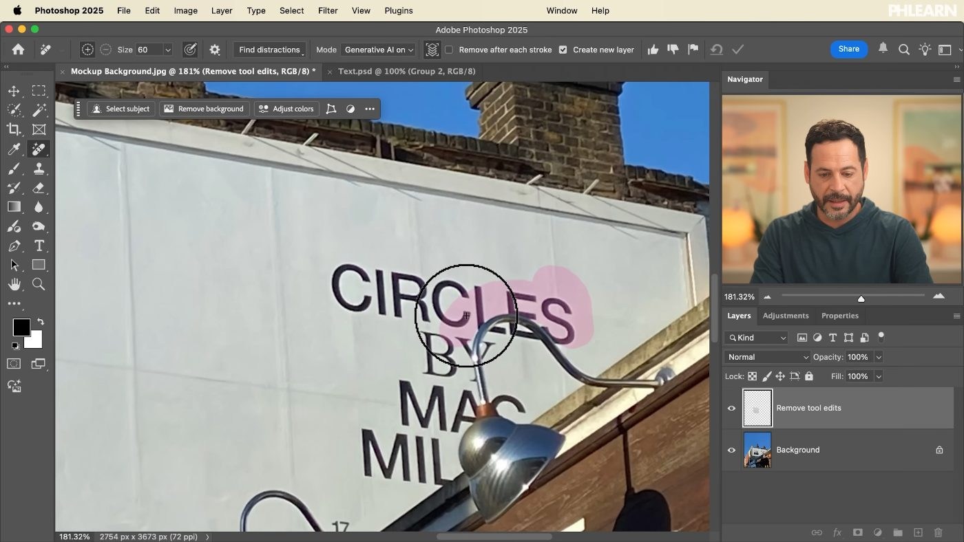 Painting over the existing billboard artwork with the Remove tool in Photoshop