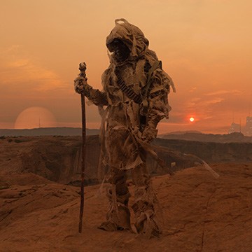 Hooded wanderer with a staff standing on red desert rock at sunset, course thumbnail for Create an Epic Composite: A Dark Force (2026 Edition)