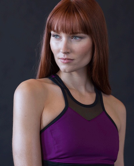 The same portrait after dramatic retouching, with sculpted light and cleaner skin