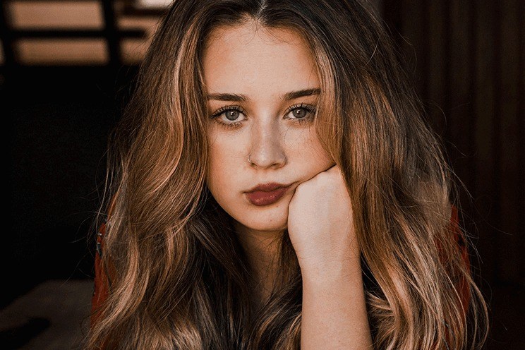 Portrait of a young woman after retouching and colour grading