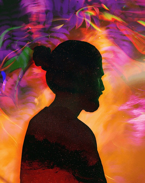 The same silhouette filled with vivid coloured smoke and light