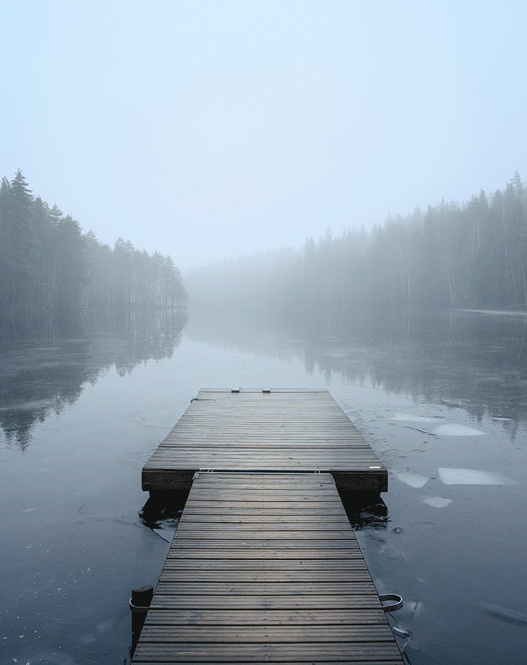 Foggy frozen lake with a wooden dock, the original stock background