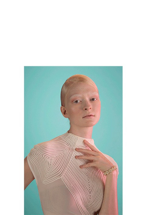 Woman photographed against a plain white studio background
