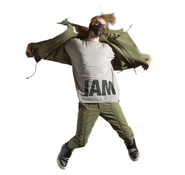 Dancer in an olive jacket caught mid-jump, cut out on white