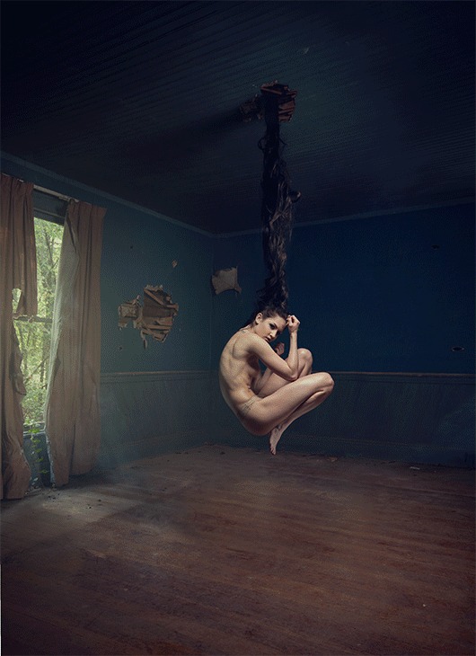 The same room warm-graded with a woman seated on the swing