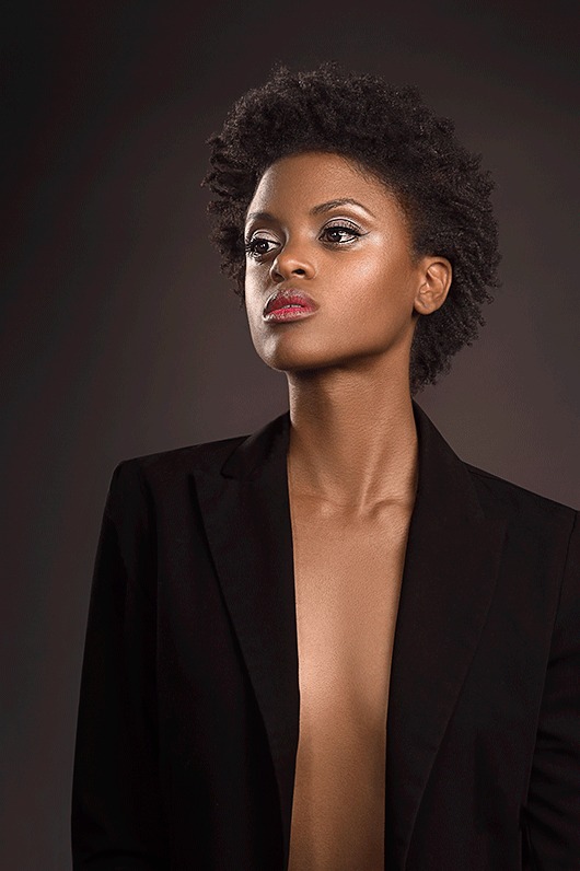 The same portrait after retouching, with smoother skin and refined contrast