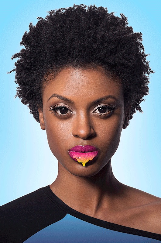 The same portrait retouched and placed on a bright blue gradient background