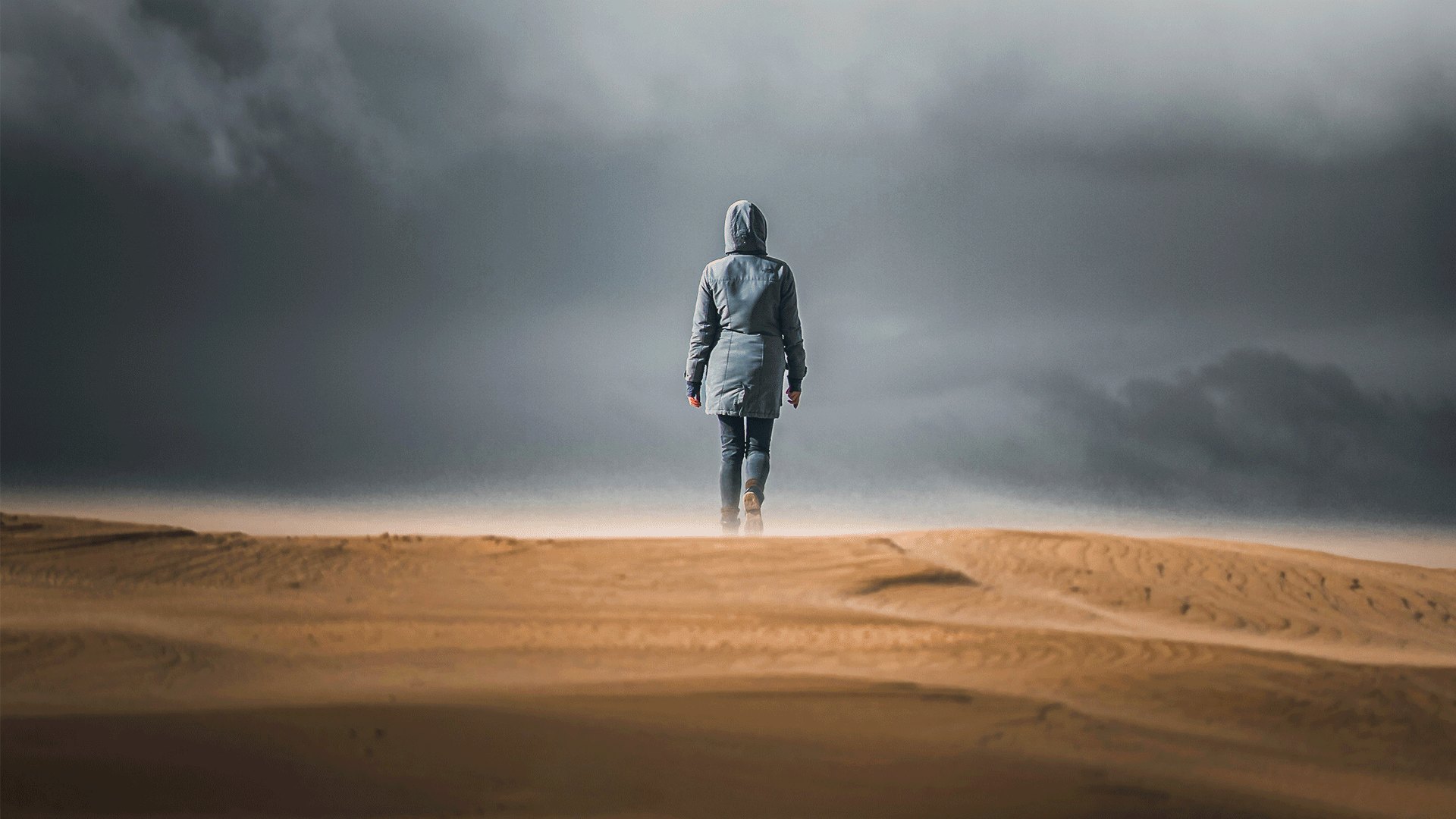The same scene with the sky darkened, the ground warmed and the figure lit with a radial gradient and luminance range masks