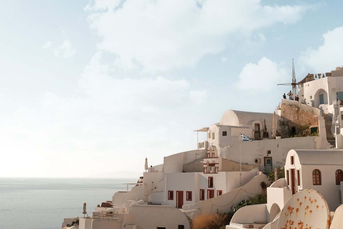 The same Santorini scene with new clouds blended into the original sky using Blend If