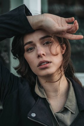 Woman resting her hand on her head