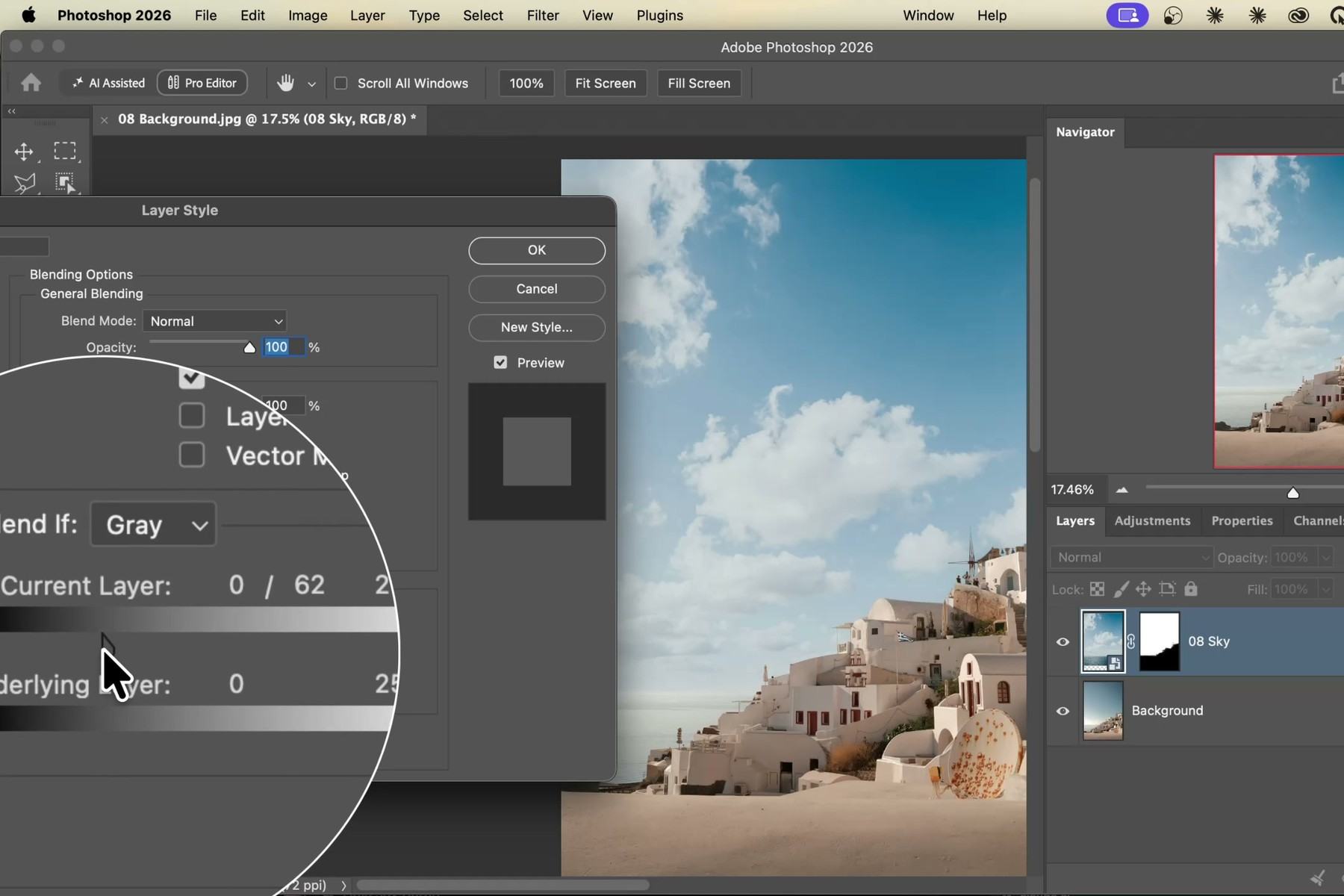 Blend If Current Layer slider split with Option in the Photoshop Layer Style dialog to blend new clouds into the original sky