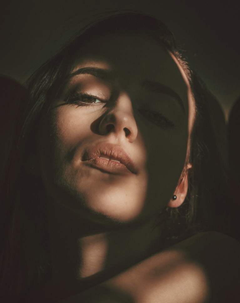 The same portrait with the Warm Film gradient map: lifted, warm brown shadows like film, her skin still natural
